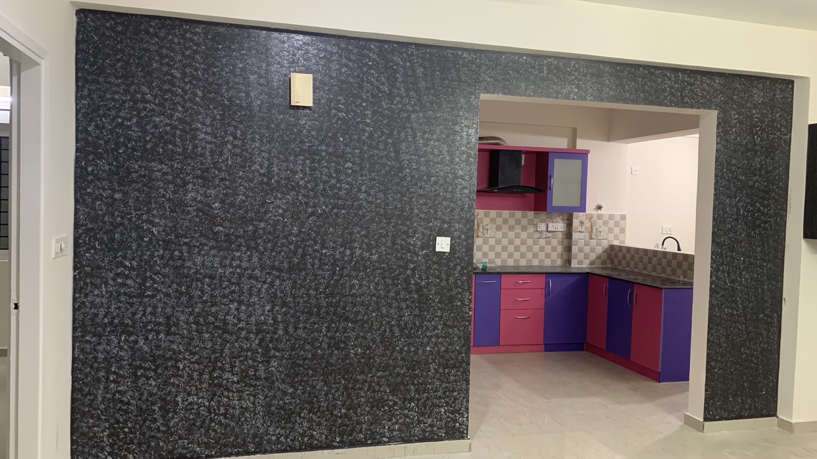 Textured feature wall and modular kitchen, Marathahalli renovation, Bangalore