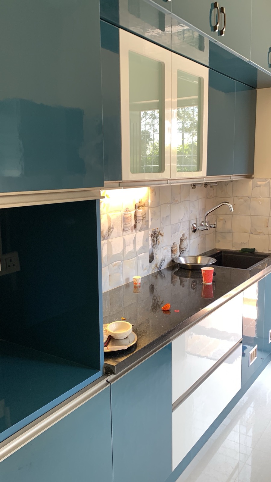 Gloss modular kitchen in teal and white, Sarjapur home, Bangalore